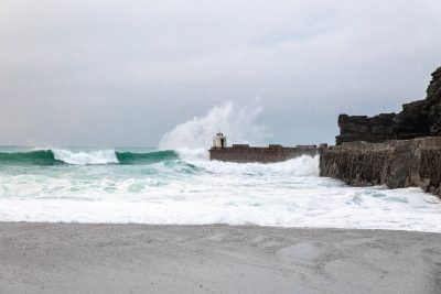 Waves Crashing Against The Pier